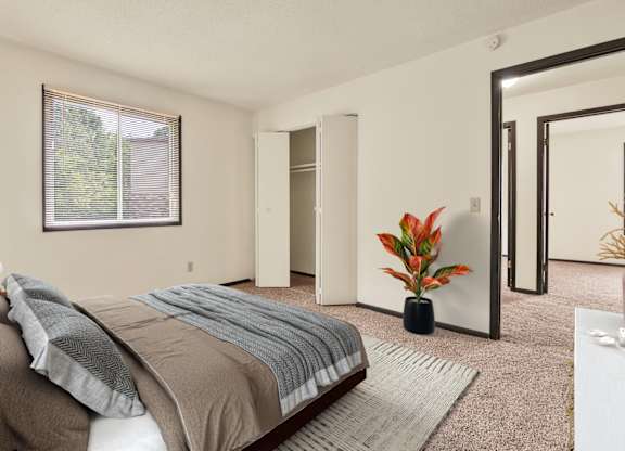 Comfortable Bedroom With Accessible Closet at Indian Ridge Apartments, Davenport, IA, 52807