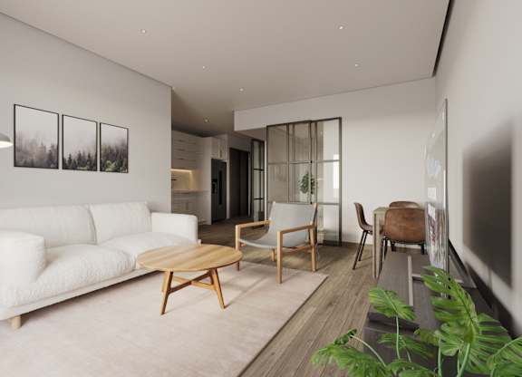 A white couch sits in a living room with a wooden coffee table in front of it at The Woods at 180 Kanata Avenue, Kanata, Ontario