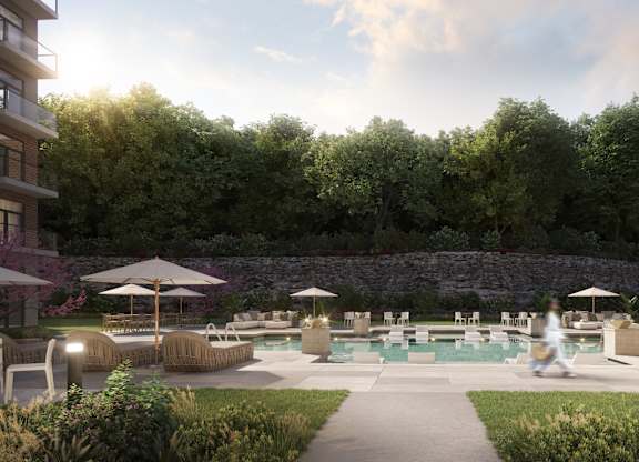 A person is walking in a garden with a swimming pool at The Woods at 180 Kanata Avenue, Kanata, Ontario, K2K 3L9