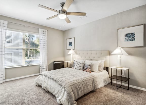 a bedroom with a bed and a ceiling fan at Reserve at Temple Terrace, Temple Terrace