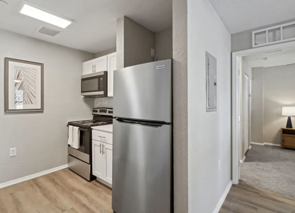 a kitchen with a refrigerator and a stove and a microwave at Reserve at Temple Terrace, Florida, 33637
