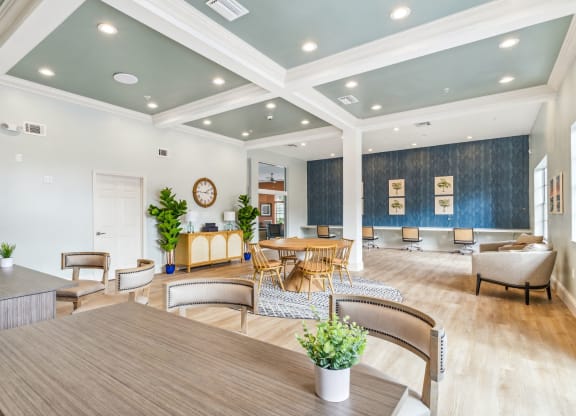 a living room with a table and chairs at Reserve at Temple Terrace, Temple Terrace
