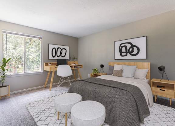 A bedroom with a bed, desk, and chair.