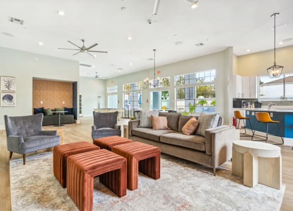 lounge with a couch and tables at Reserve at Temple Terrace, Temple Terrace, FL