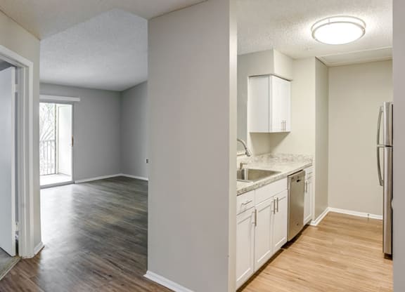 Living Room With Kitchen View at Newport Colony Apartment Homes, Florida, 32707