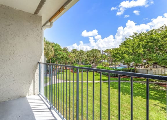 the view from the balcony of a house with a metal fence at Waterford Park Apartment Homes, LLC, Lauderhill, 33319