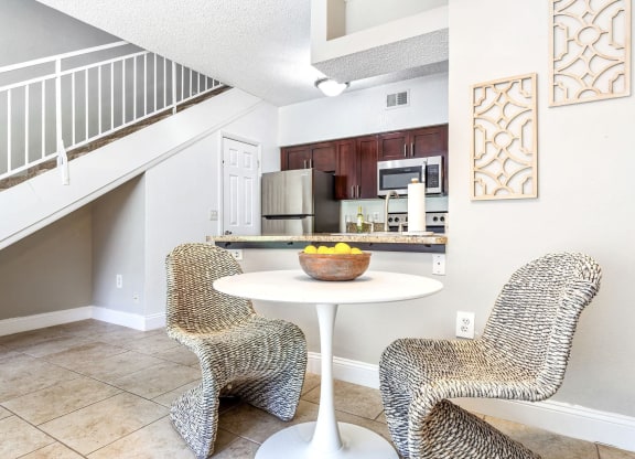 a living room with two chairs and a table at Waterford Park Apartment Homes, LLC, Florida, 33319