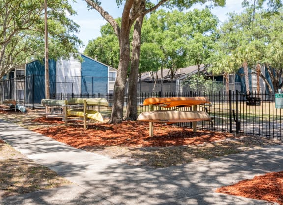 the preserve at ballantyne commons community picnic area with benches and trees  at Fisherman's Landing Apartment Homes, Tampa