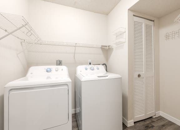 a laundry room with two washes and a dryer  at Fisherman's Landing Apartment Homes, Tampa, FL, 33637
