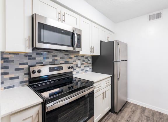 the preserve at ballantyne commons apartment kitchen with stainless steel appliances  at Fisherman's Landing Apartment Homes, Tampa, FL