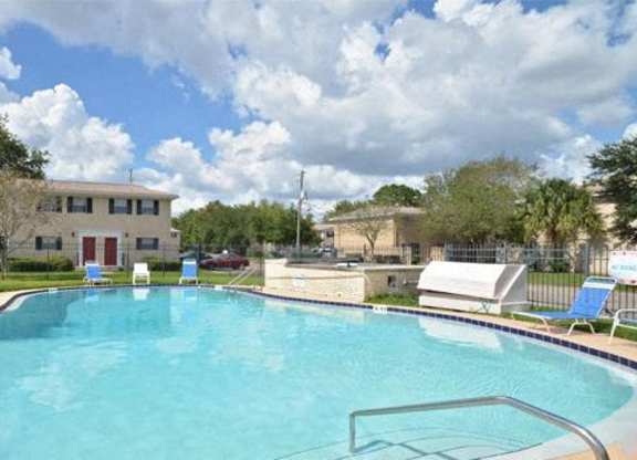 A swimming pool with a metal ladder in the middle.