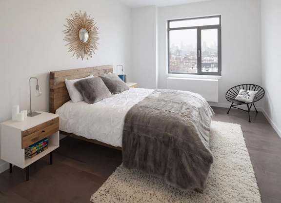 Bedroom with a Bed at The Grove Apartments, Astoria