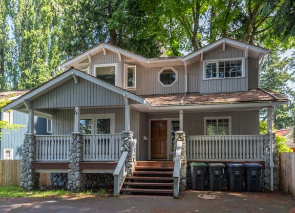 a house with a front porch and steps leading up to it