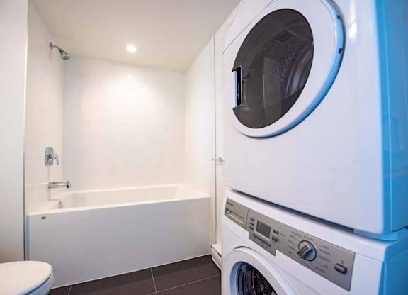a bathroom with a washer and dryer