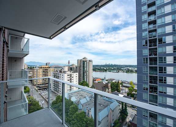 a balcony with a view of the city