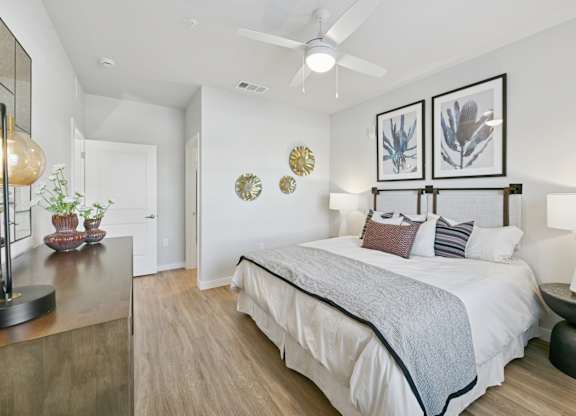 A bedroom with a large bed and a ceiling fan.at Allegra at Cocoa in Cocoa, FL, 32926