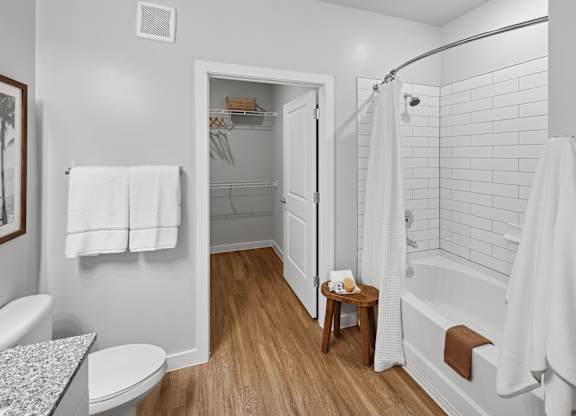 A white bathroom with a toilet, sink, and bathtub. at Allegra at Cocoa in Cocoa, FL, 32926