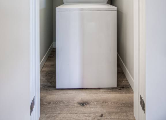 a washer and dryer in a small laundry room