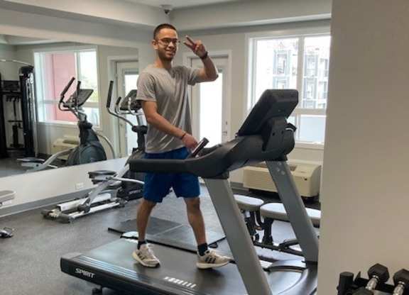 a man is on a treadmill in a gym