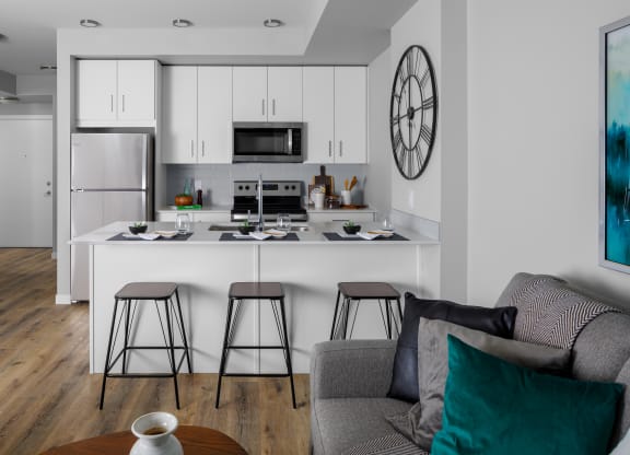 a kitchen and living room in a 555 waverly unit