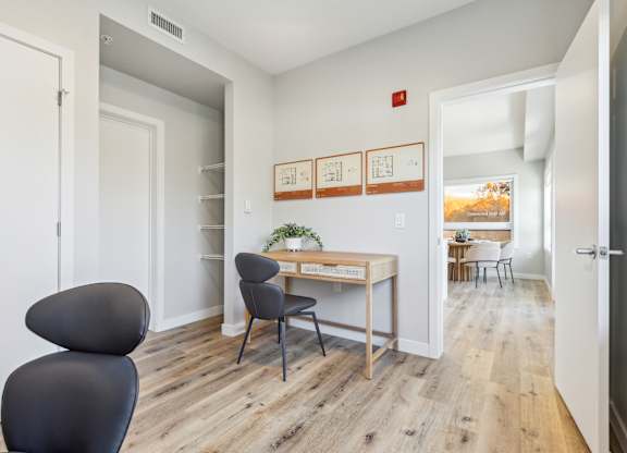A room with a desk and a chair.