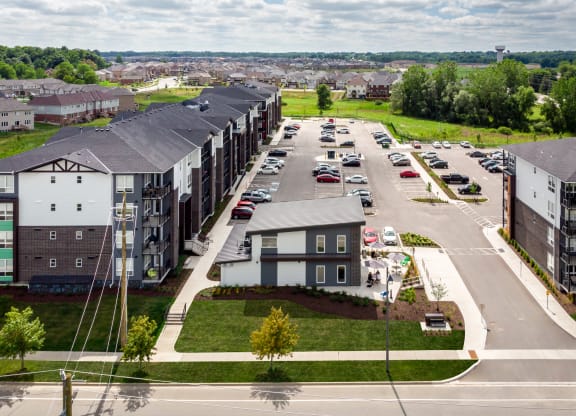 a view from the top of a building of a street with cars parked on the side of