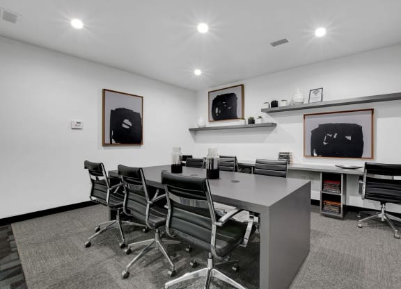 a conference room with a long desk and chairs at Evoq Apartment Homes, Las Vegas Nevada  