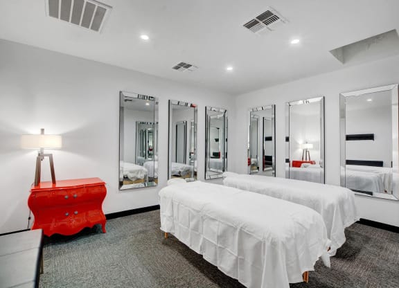 a bedroom with two beds and a red dresser at Evoq Apartment Homes, Las Vegas, 89169  