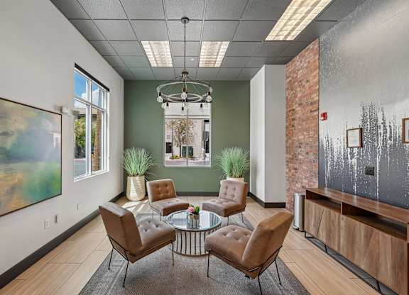 A room with a glass table and chairs.
