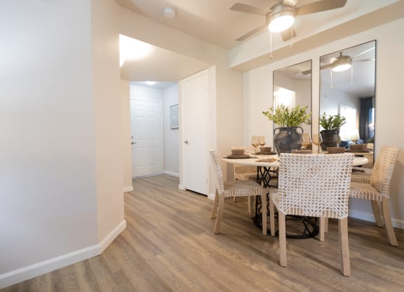 a living room and dining room with a table and chairs at Austin Crest Apartments, Reno, 89523
