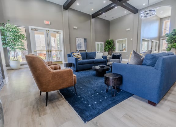 a living room with couches and chairs and a rug at Austin Crest Apartments, Reno, NV, 89523
