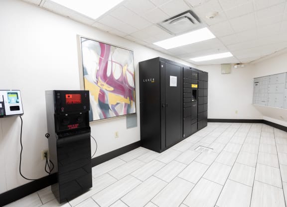 a room with black lockers and a machine on the floor at ParcOne60, Reno, 89501
