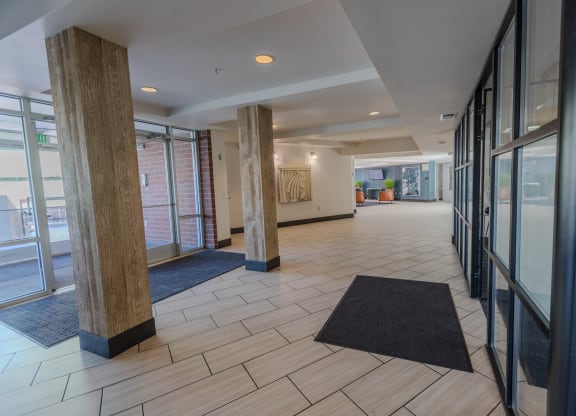 the lobby of a building with windows and rugs at ParcOne60, Reno, NV, 89501