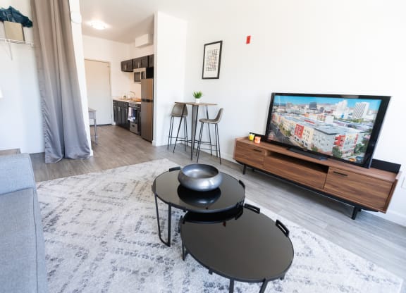 a living room with a flatscreen tv and a couch at ParcOne60, Reno, 89501