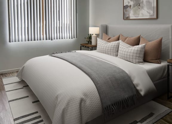 a bedroom with a bed and a rug at Evoq Apartment Homes, Nevada, 89169