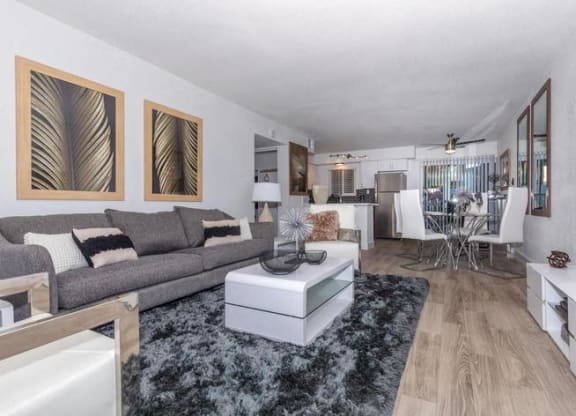 a living room with a couch and a table at Evoq Apartment Homes, Nevada, 89169