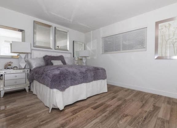 a bedroom with a bed and a window at Evoq Apartment Homes, Nevada  