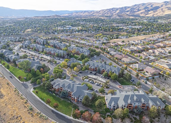 an aerial view of a neighborhood with houses and a highway at Austin Crest Apartments, Reno, 89523