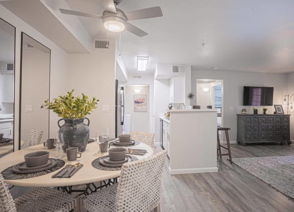 an open living room and dining room with a table and chairs at Austin Crest Apartments, Reno