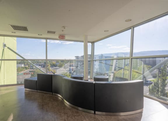 a seating area in a building with a view of the city at The Onyx at 695, Reno, 89503