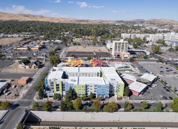 an aerial view of a city with buildings and a parking lot at The Onyx at 695, Nevada, 89503