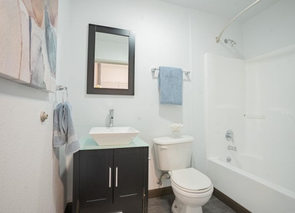 a bathroom with a toilet sink and a shower at The Onyx at 695, Reno
