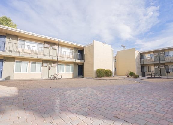 the outlook of two apartment buildings with a brick courtyard at Regency Park, Reno, NV