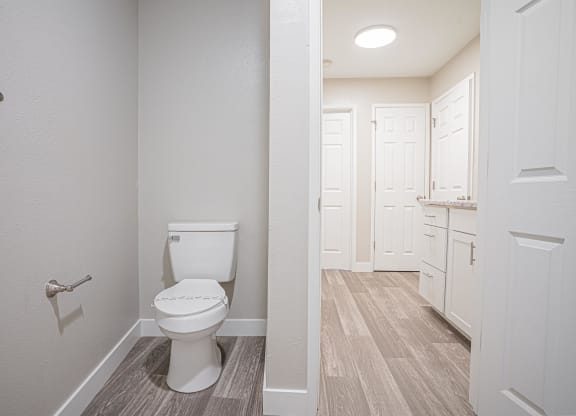 an empty bathroom with a toilet and a white closet at Regency Park, Nevada, 89509