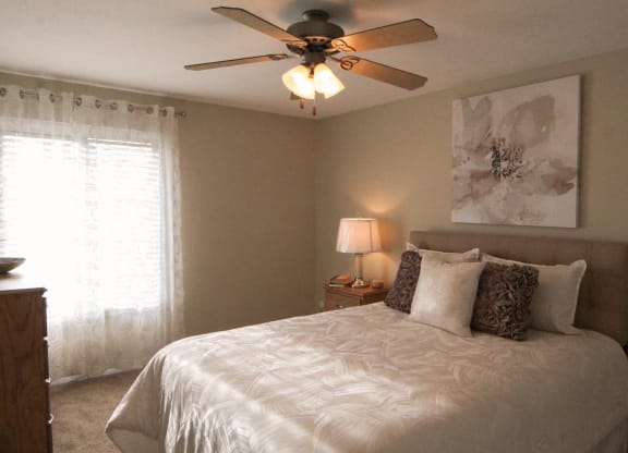 a bedroom with a bed and a ceiling fan at Monroeville Apartments, Pennslyvania, 15146