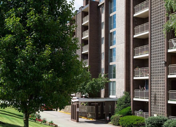 a tree in front of an apartment building at Monroeville Apartments, Monroeville, PA