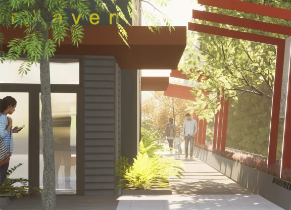 A street view with a cafe and a person walking at Nook at Northaven Apartments, Seattle