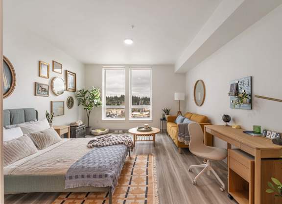 A bedroom with a bed, desk, and chair at Nook at Northaven Apartments, Seattle, 98125