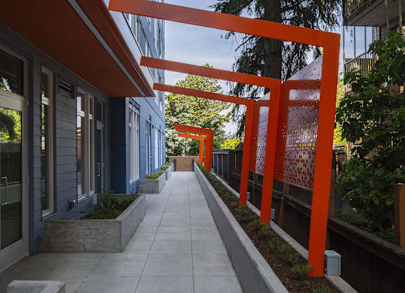 A long, narrow walkway with orange supports on either side.