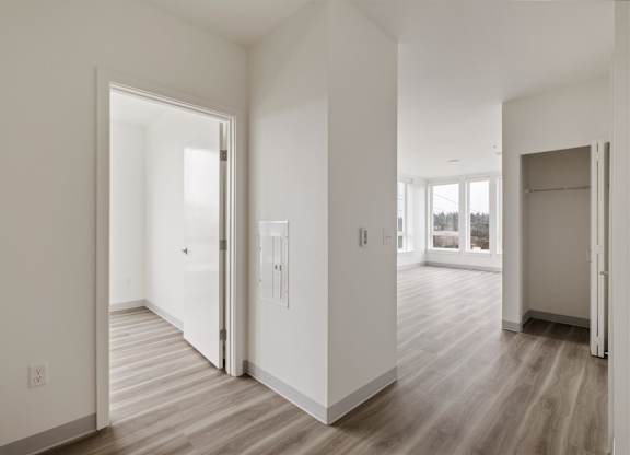 A white room with a doorway leading to another room at Nook at Northaven Apartments, Seattle, WA